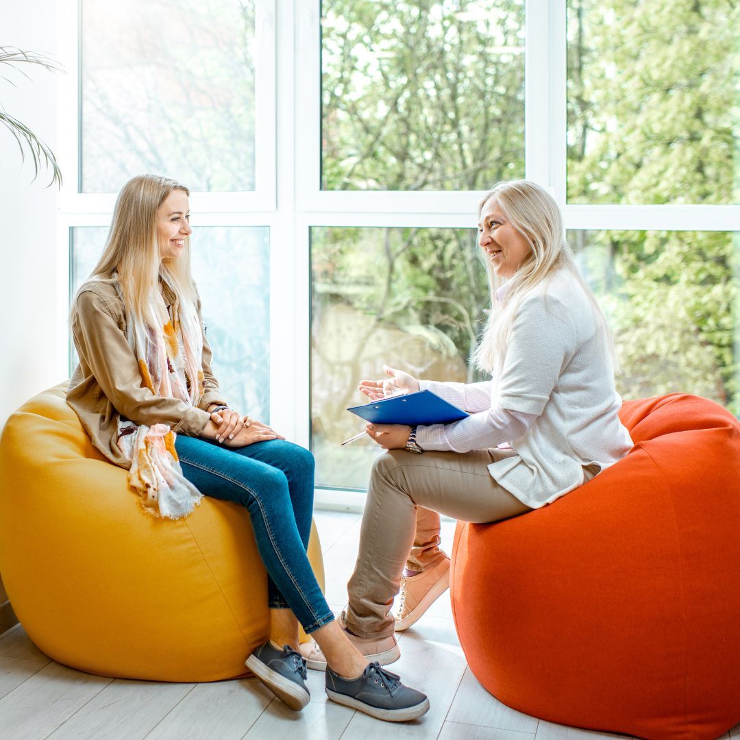 a woman meeting with a counselor