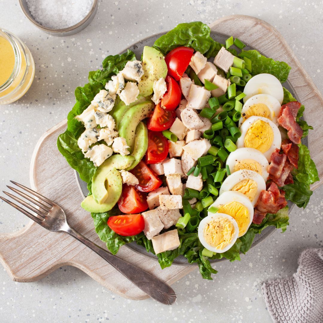 Salad with lots of healthy toppings on it. 