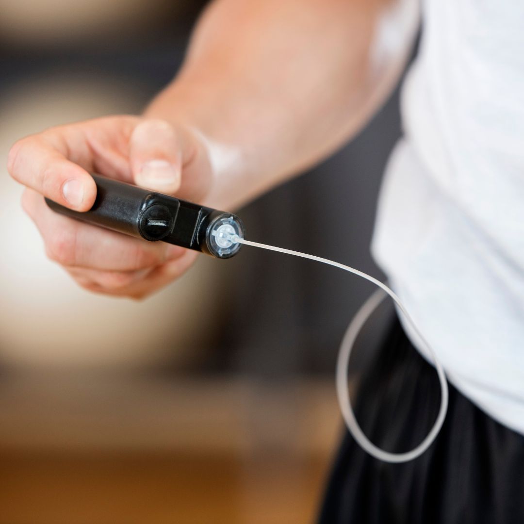 a person using a flash glucose monitor