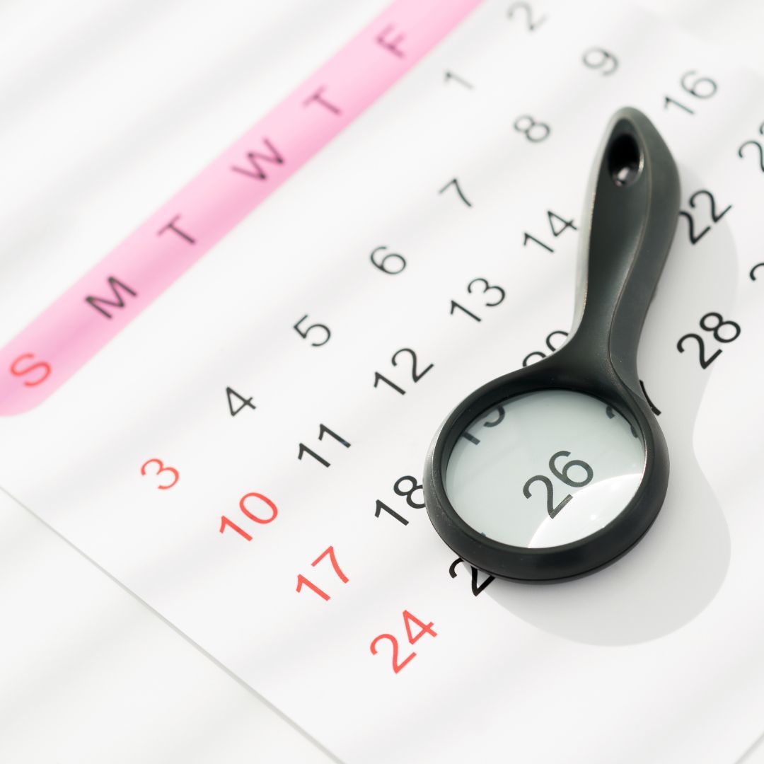 Magnifying glass on calendar