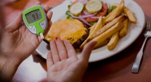 a women checking her blood sugar before a meal