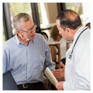 a man talking to his doctor about his glucose levels