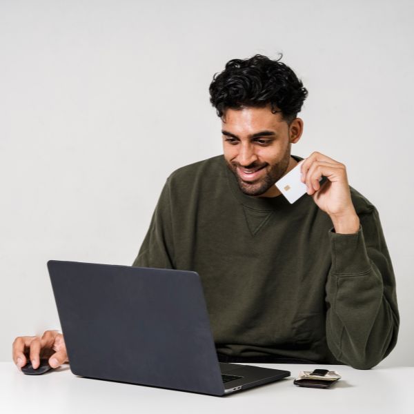 man smiling shopping online