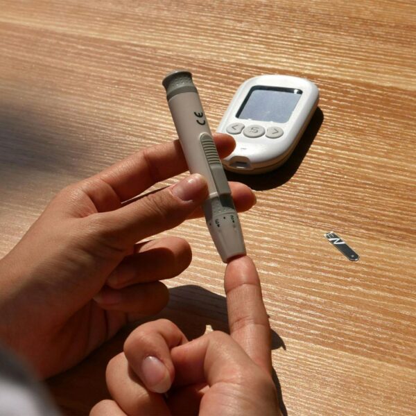 Person using a glucose monitor