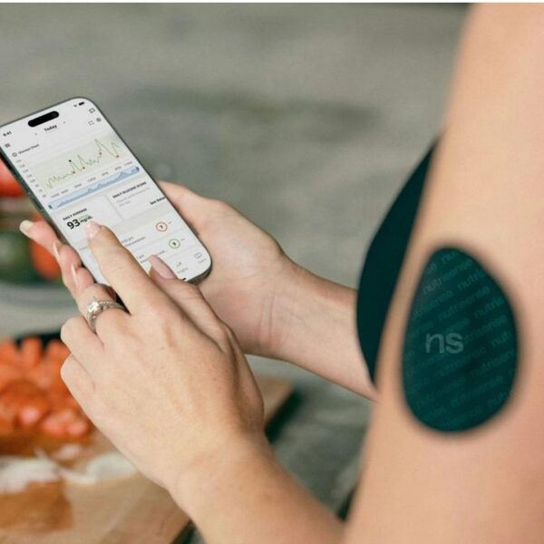 woman checking her blood sugar on app